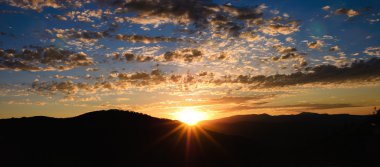 Panorama of a sunrise above Park City, Utah clipart