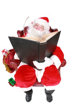 Santa writing in the book of names of good children clipart