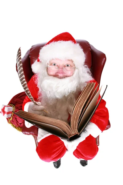 Santa γράφει στο βιβλίο του τα ονόματα των παιδιών καλό — Φωτογραφία Αρχείου