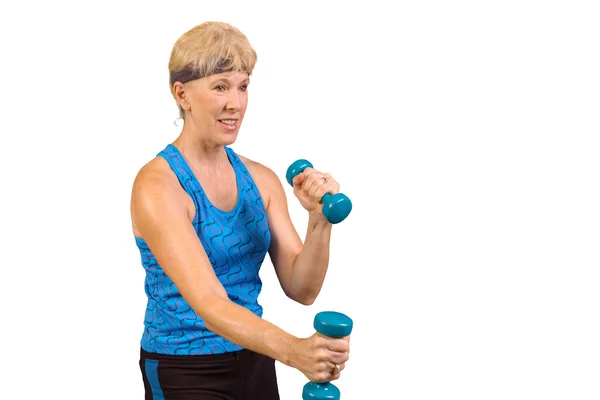 Attractive baby-boomer exercising with weights isolated over black — Stock Photo, Image