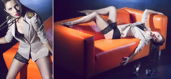 Glamouröses Mädchen auf der orangefarbenen Couch — Stockfoto