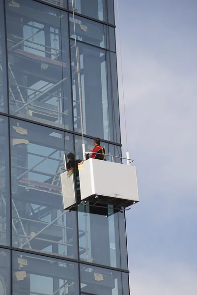A Window washer work high in a building — Stock Photo, Image