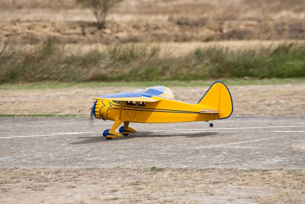 Remote controlled yellow airplane — Stock Photo, Image