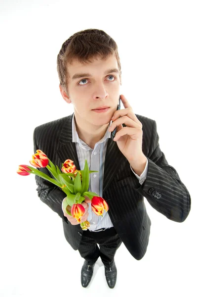 Biznesmen oferuje tulipan — Zdjęcie stockowe