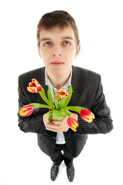 Empresário oferecendo tulipa — Fotografia de Stock