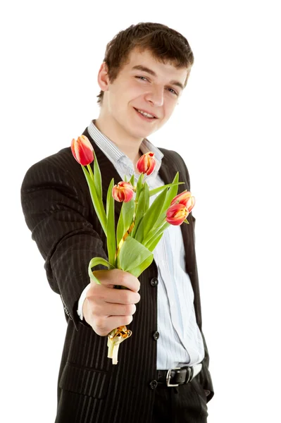 Businessman offering tulip Stock Photo