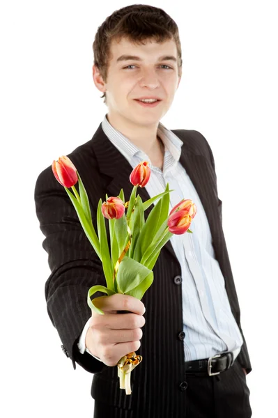 Businessman offering tulip Stock Image