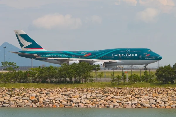 Um Boeing 747 Cathay Pacific Fotos De Bancos De Imagens