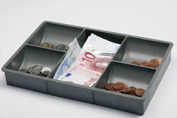 Euron i en öppen pengar låda — Stockfoto