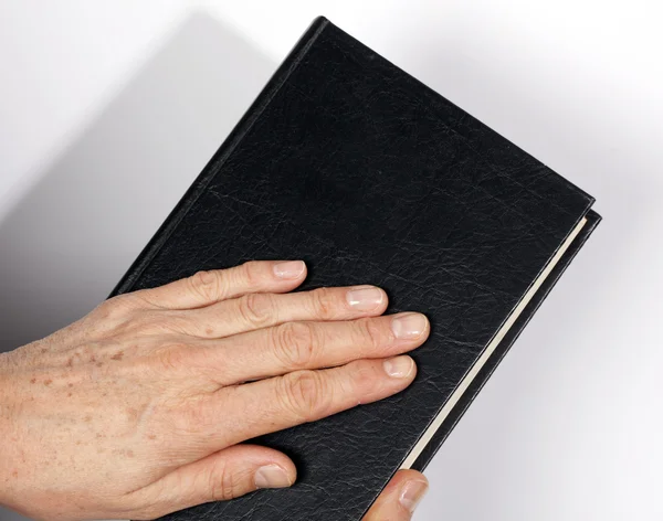 Bible with hand — Stock Photo, Image