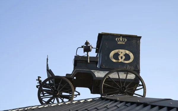Bagerens vogn på taget - Stock-foto