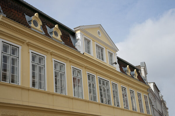 Windows in a yellow house. Shot from Lübeck, Germany