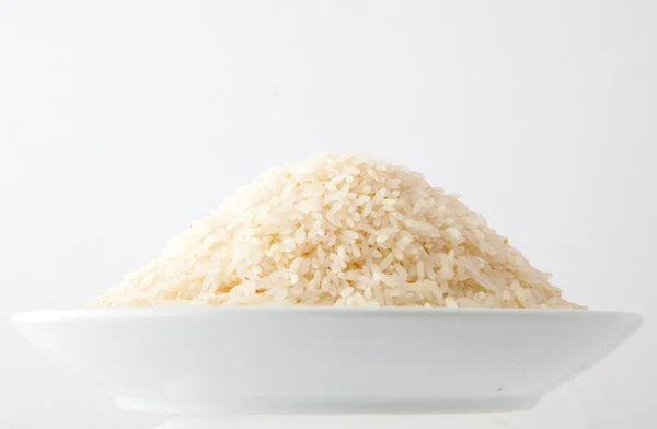 stock image Bowl with Raw rice in white background