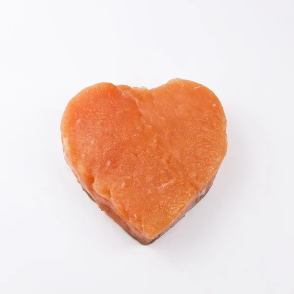 Heart shaped salmon fillet on a white background — Stock Photo, Image