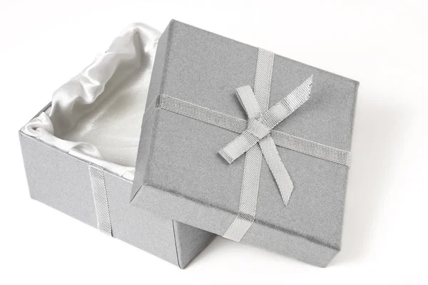Open silver box with top leaning against the bottom — Stock Photo, Image