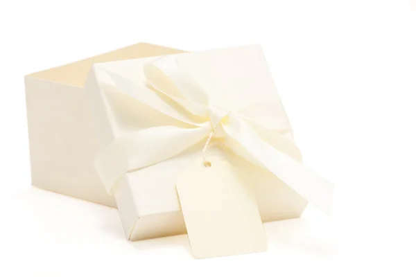 Partially opened cream colored gift box — Stock Photo, Image
