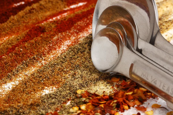 Hot seasoning of taco ingredients with measuring spoons — Stock Photo, Image