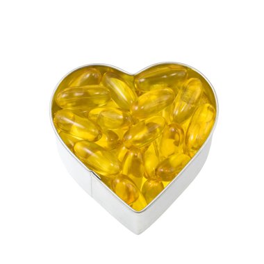 Top down view of silver heart filled with salmon oil clipart