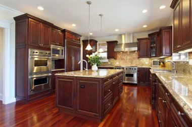 Kitchen with cherry wood cabinetry clipart