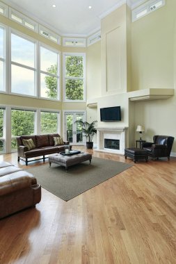 Living room with two story windows clipart