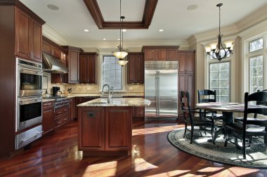 Luxury kitchen with cherry wood cabinetry clipart