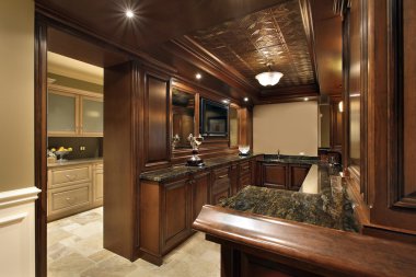 Bar in basement of luxury home clipart