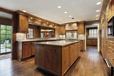 Tradiitional kitchen with oak wood cabinetry clipart