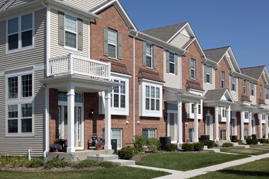 Row of brick townhouses clipart