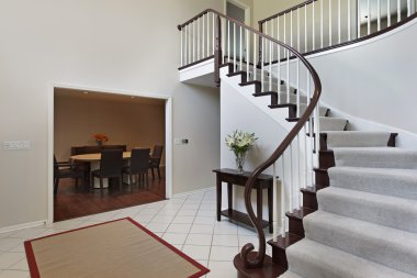 Foyer with curved staircase clipart