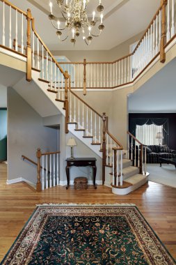 Foyer with wood trim railing clipart