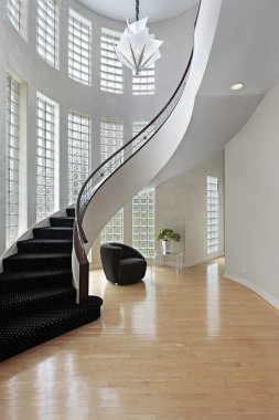 Foyer with curved staircase clipart