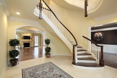 Foyer with curved staircase clipart