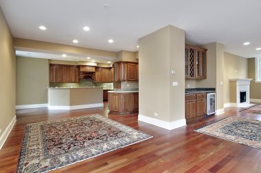 Family room with cherry wood floors clipart