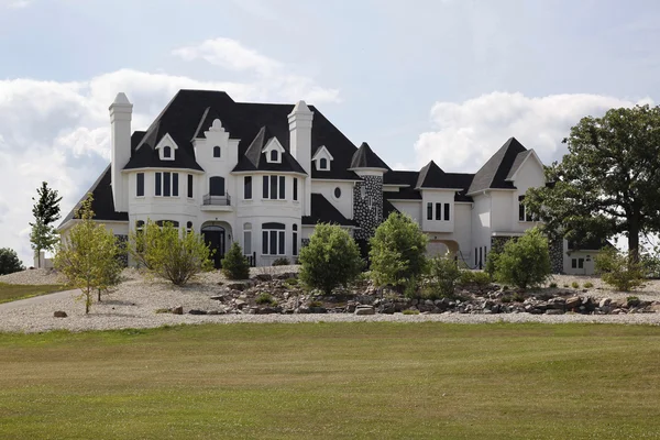 Luxury home with stone landscaping — Stock Photo, Image