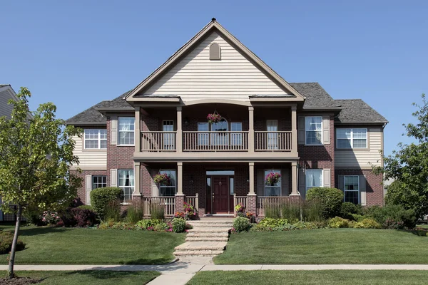 Brick home with front balcony — Stock Photo, Image