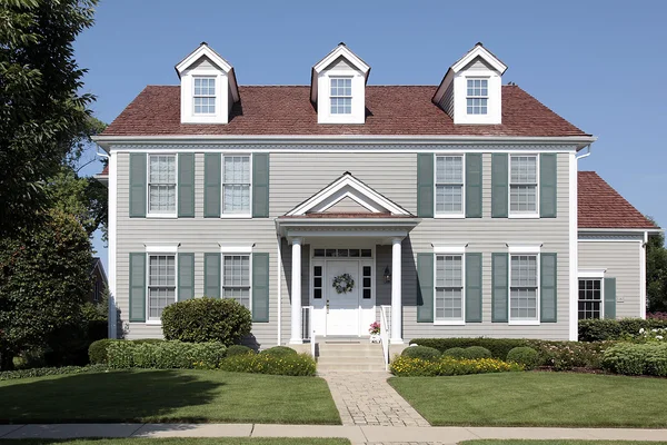 Suburban home with green shutters — Stock Photo, Image