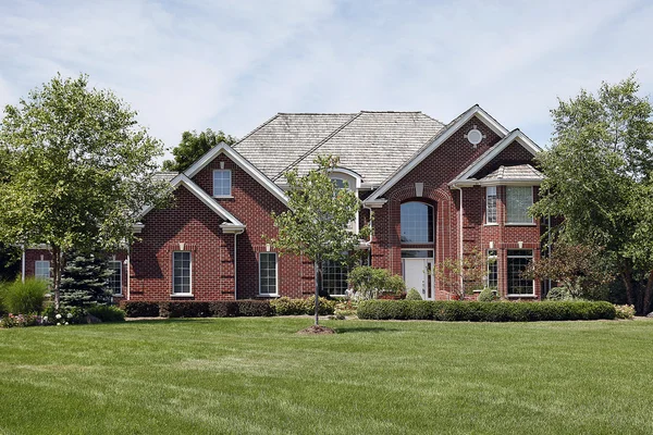 Large brick home in suburbs — Stock Photo, Image