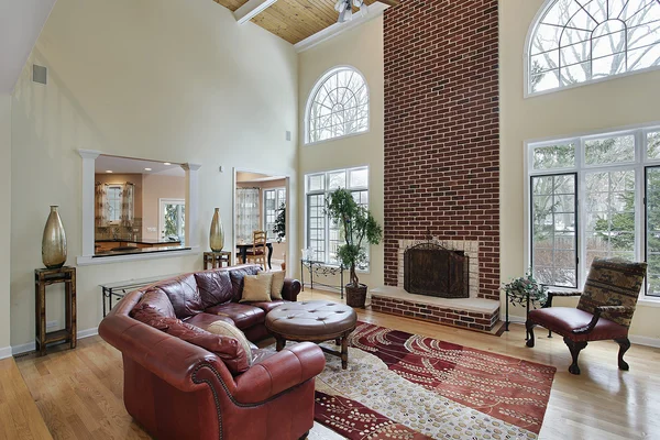 Family room with two story brick fireplace — Stock Photo, Image