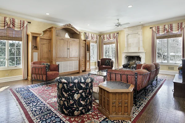 Family room with stone fireplace — Stock Photo, Image