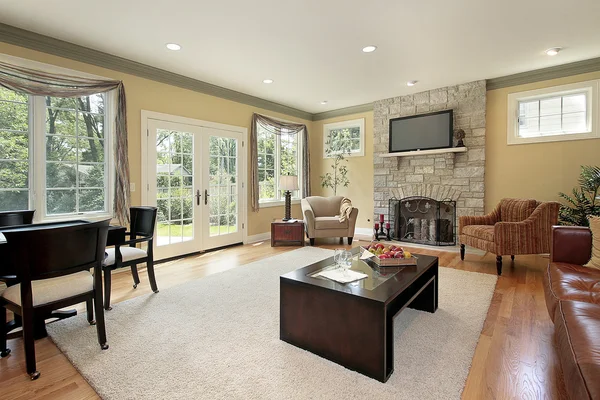 Family room with stone fireplace — Stock Photo, Image