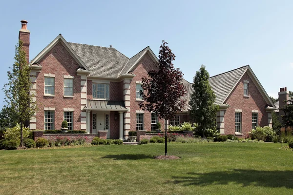 Large brick home with front columns Stock Picture