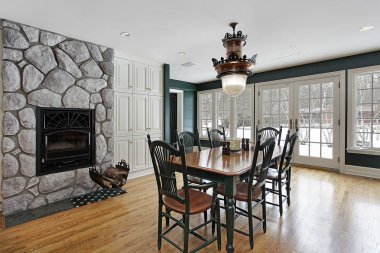 Breakfast room with stone fireplace clipart