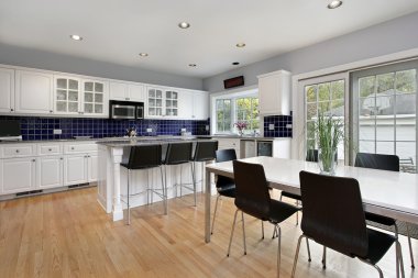 Kitchen with blue tile backsplash clipart