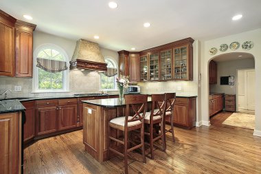 Kitchen with cherry wood cabinetry clipart