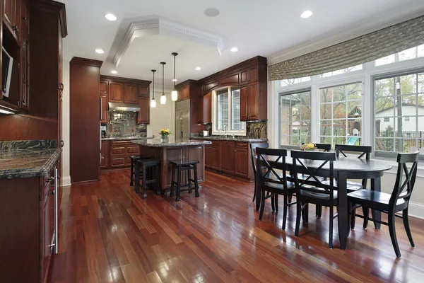 Kitchen with cherry wood flooring — Stock Photo, Image