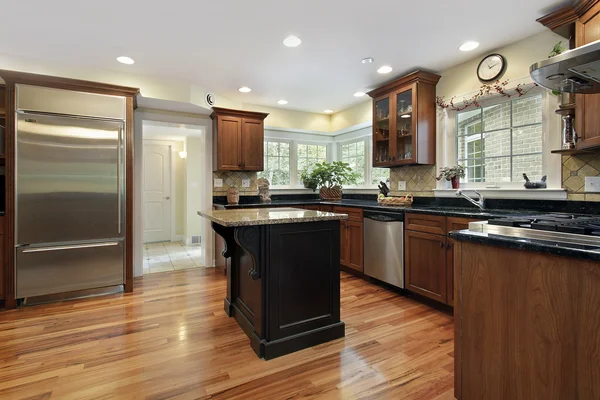 Kitchen with black and granite island — Stock Photo, Image