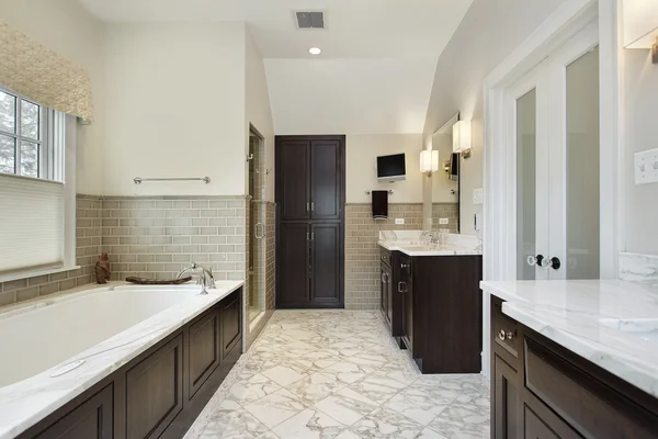 Master bath with dark wood cabinetry — Stock Photo, Image