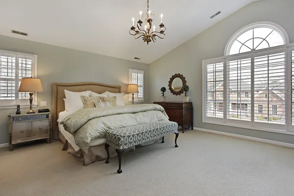Master bedroom with circular window — Stock Photo, Image