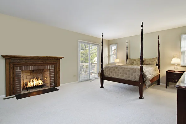 Master bedroom with fireplace — Stock Photo, Image