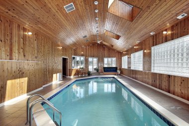 Swimming with wood paneled ceiling clipart